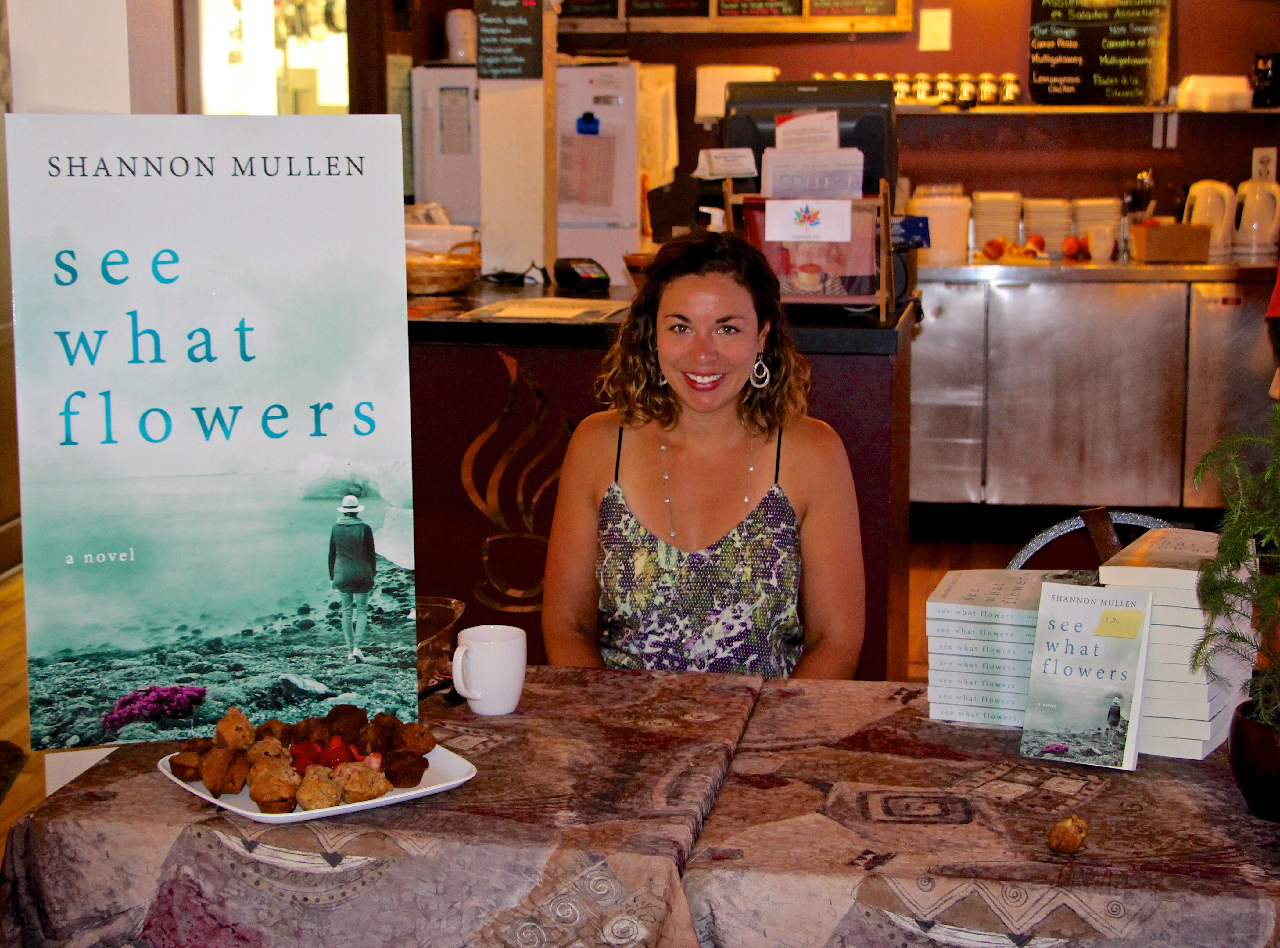 signing books at cafe 349